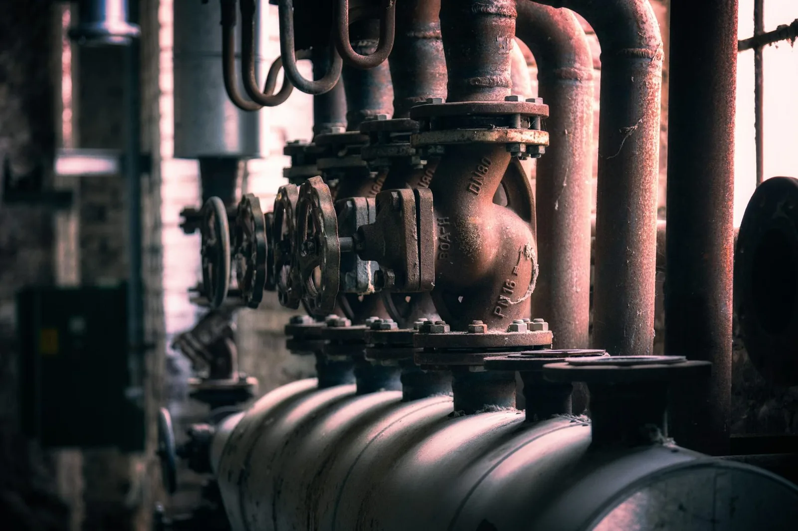 Industrial boiler piping and flanged valve in a mechanical room